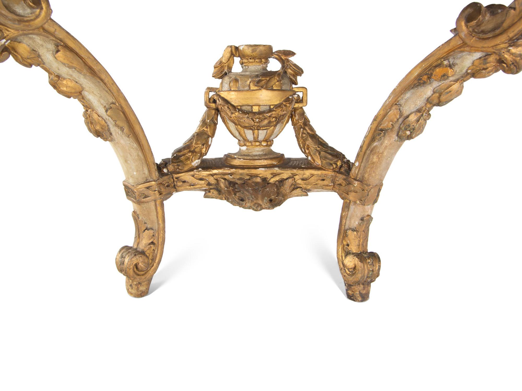 An Italian Rococo Parcel-Gilt and White-Painted Carved Wood Marble-Top Console Table