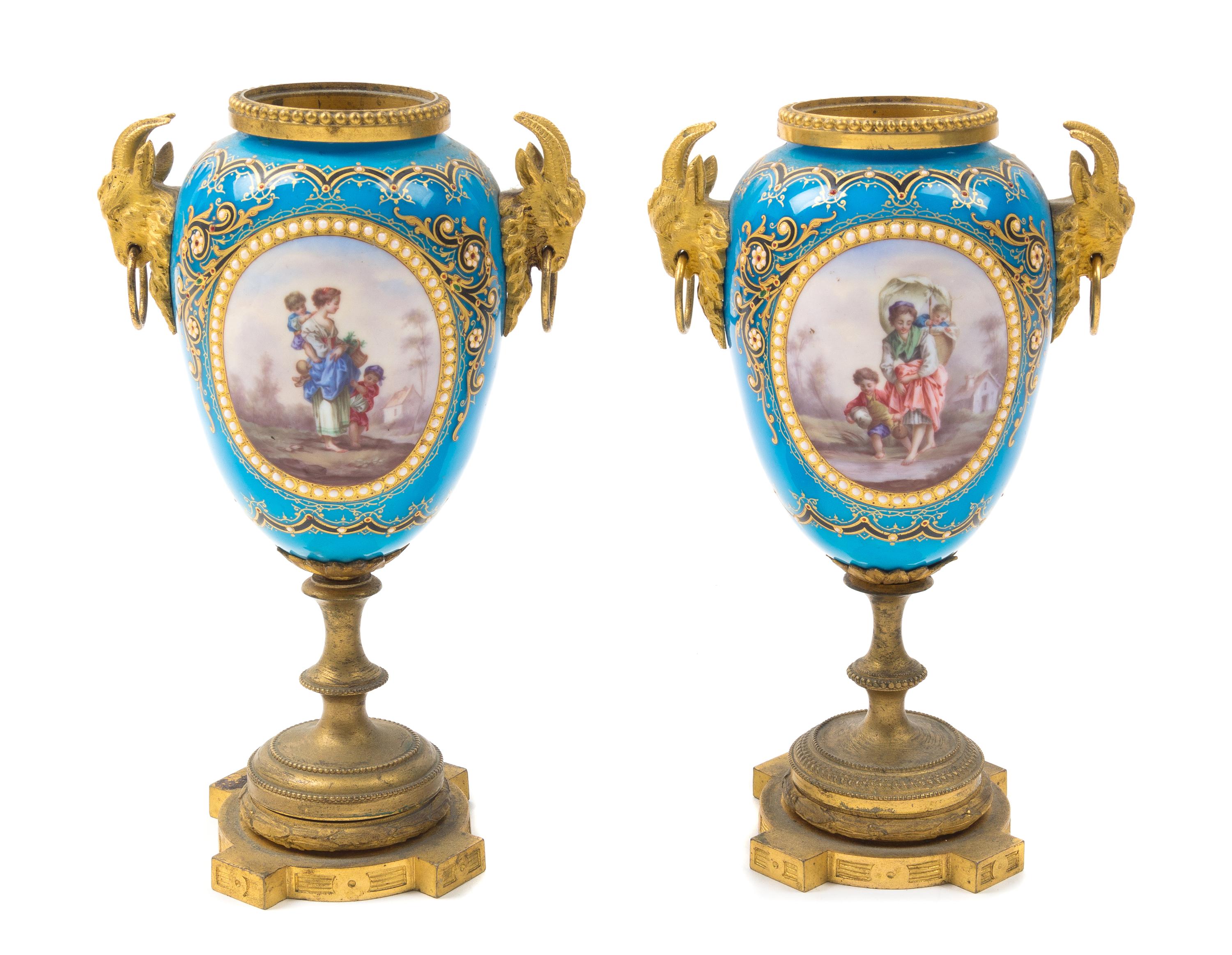A Pair of Sevres Style Gilt Bronze Mounted Porcelain Urns Height 7 3/4 inches. — 19TH CENTURY