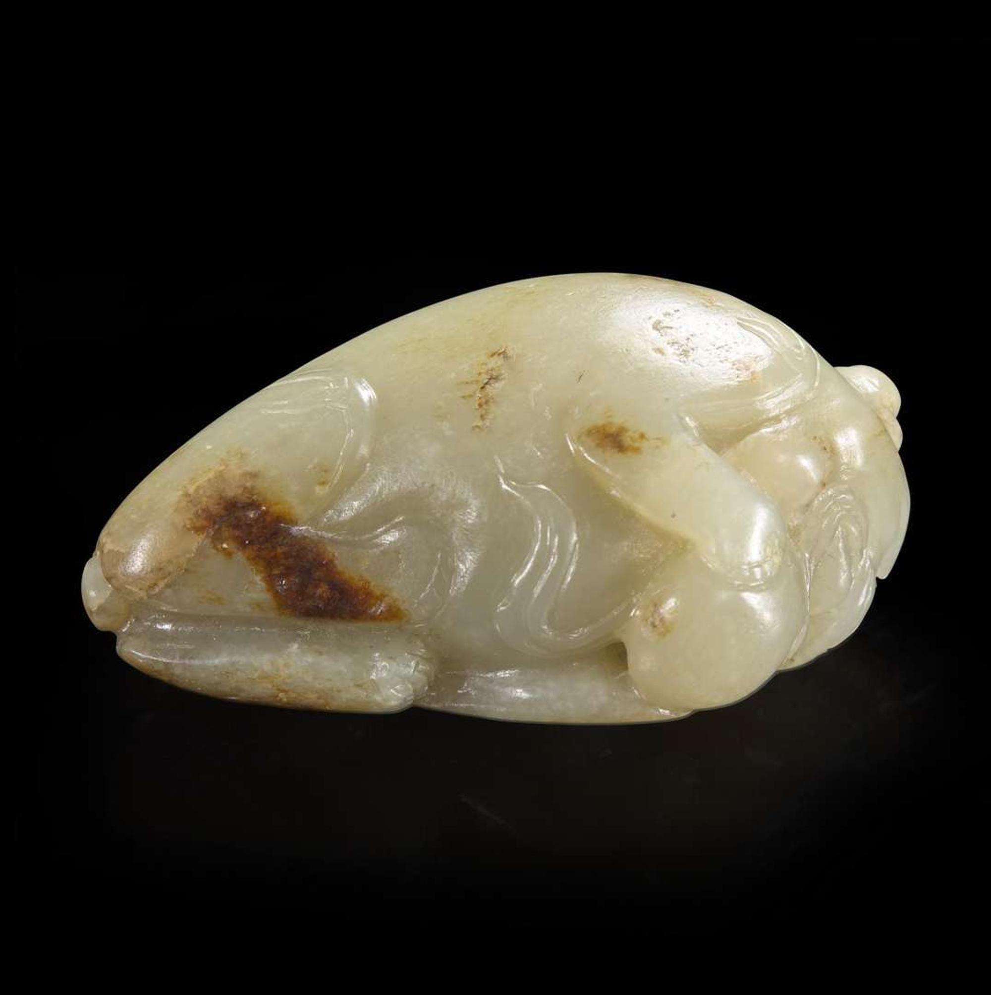 A Chinese carved pale celadon-grey and beige jade Buddhist lion 青灰玉雕太狮少狮 Qing dynasty ?