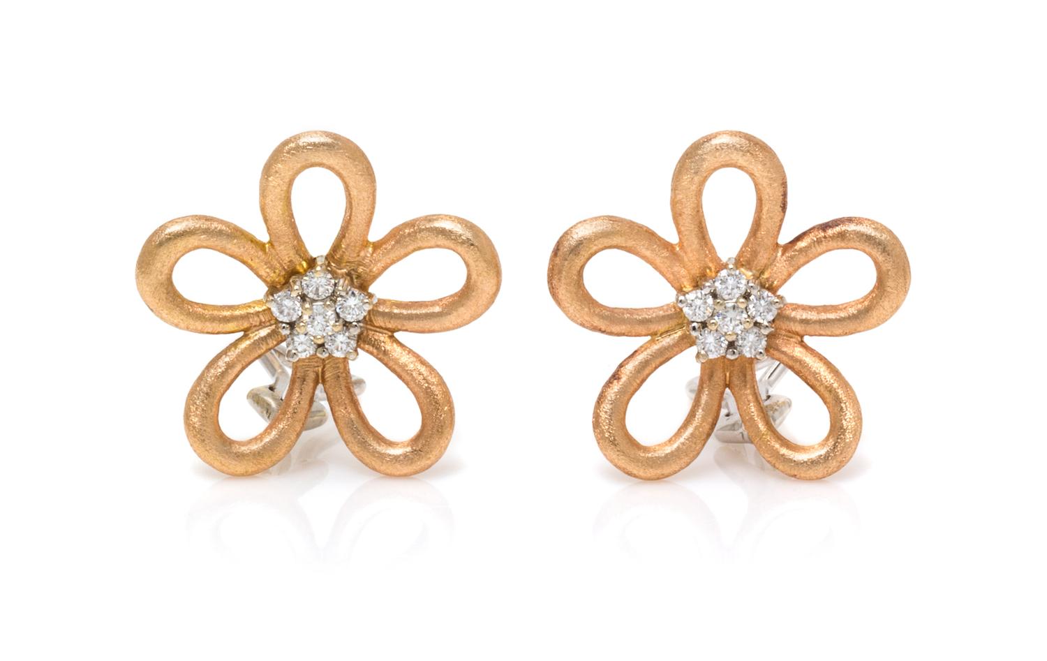 A Pair of Bicolor Gold and Diamond Flower Motif Earclips, 10.10 dwts.
