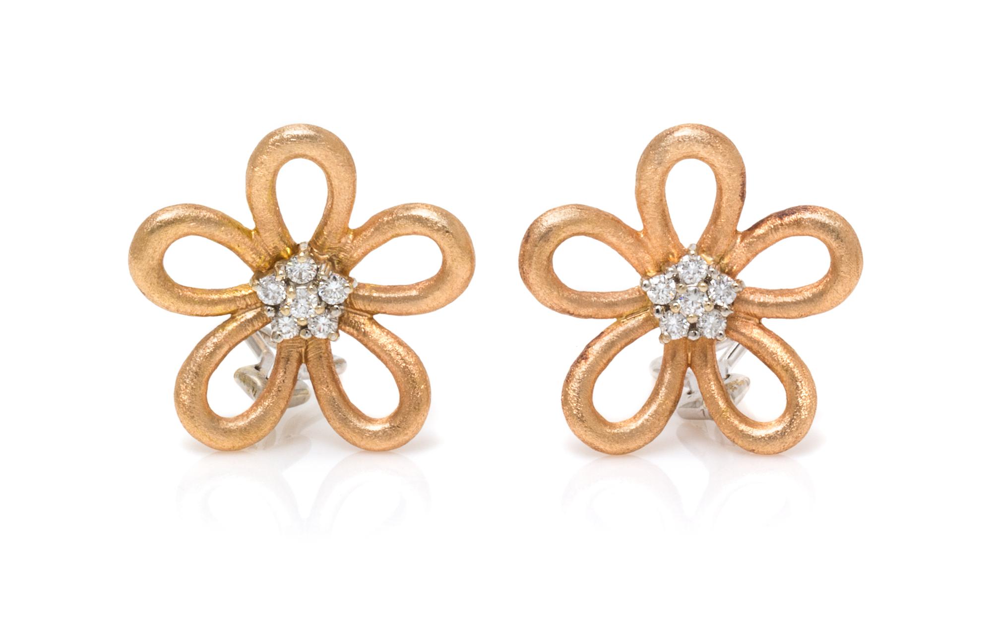 A Pair of Bicolor Gold and Diamond Flower Motif Earclips, 10.10 dwts.