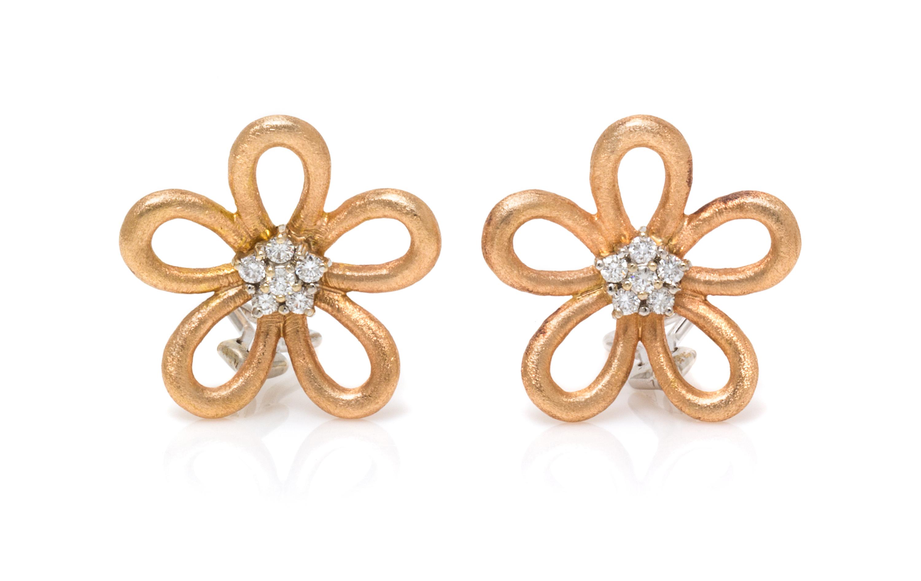 A Pair of Bicolor Gold and Diamond Flower Motif Earclips, 10.10 dwts.