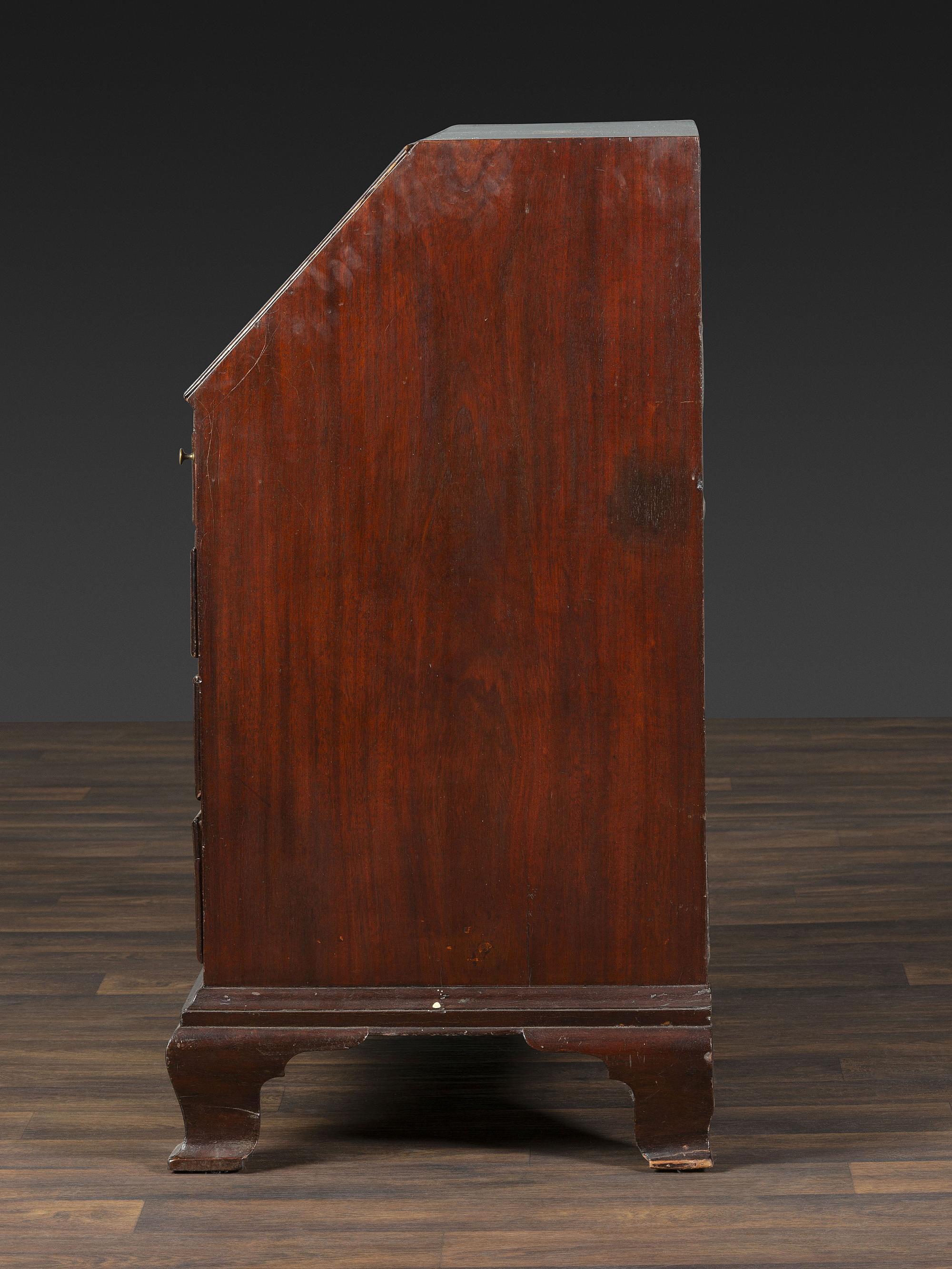 A Chippendale Figured and Shell-Carved Mahogany Slant Front Desk