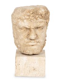 A Continental Carved Stone Head of a Man