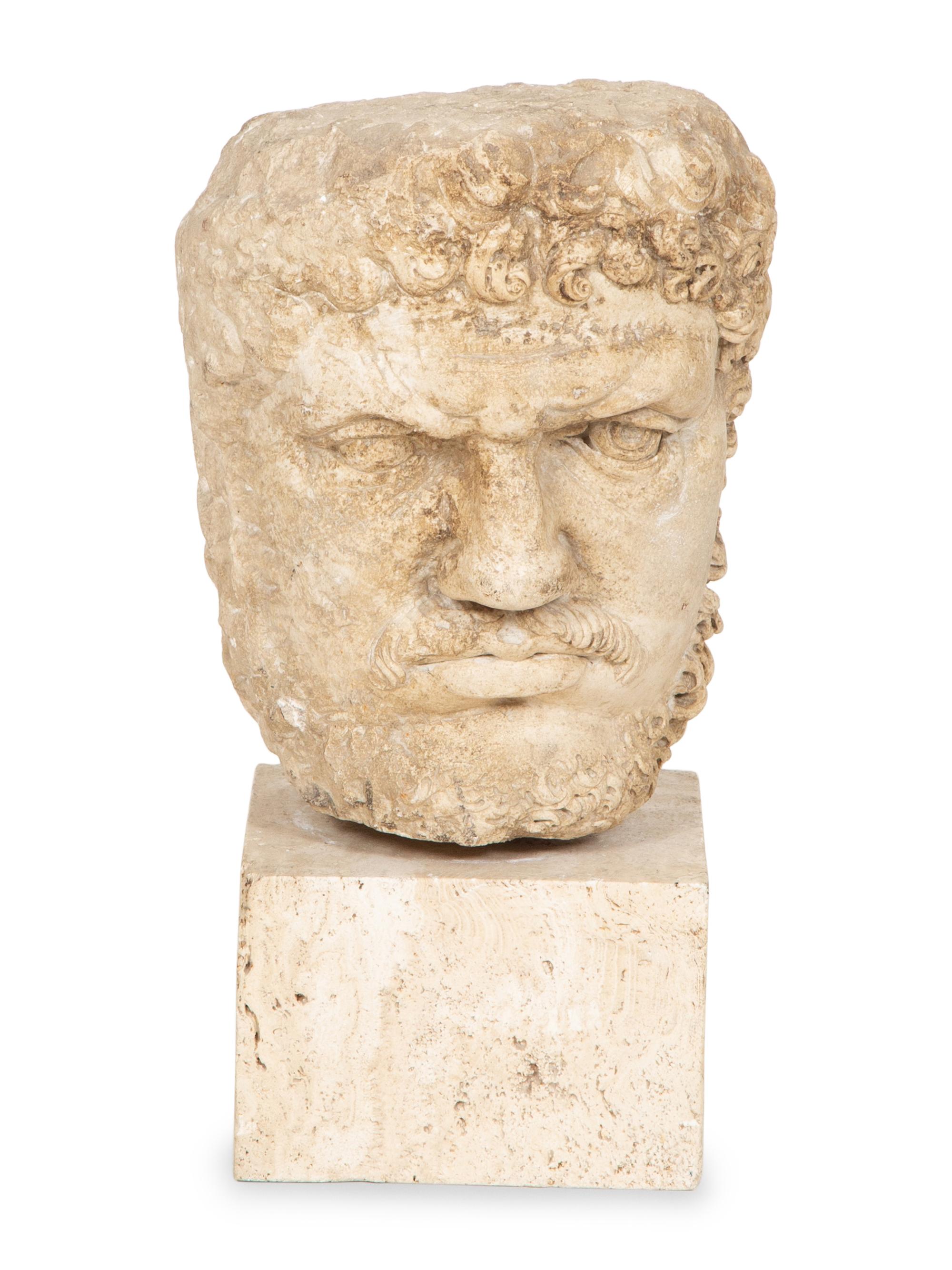 A Continental Carved Stone Head of a Man