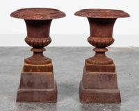 A Pair of Victorian Style Cast Iron Urns Height 12 1/2 inches.