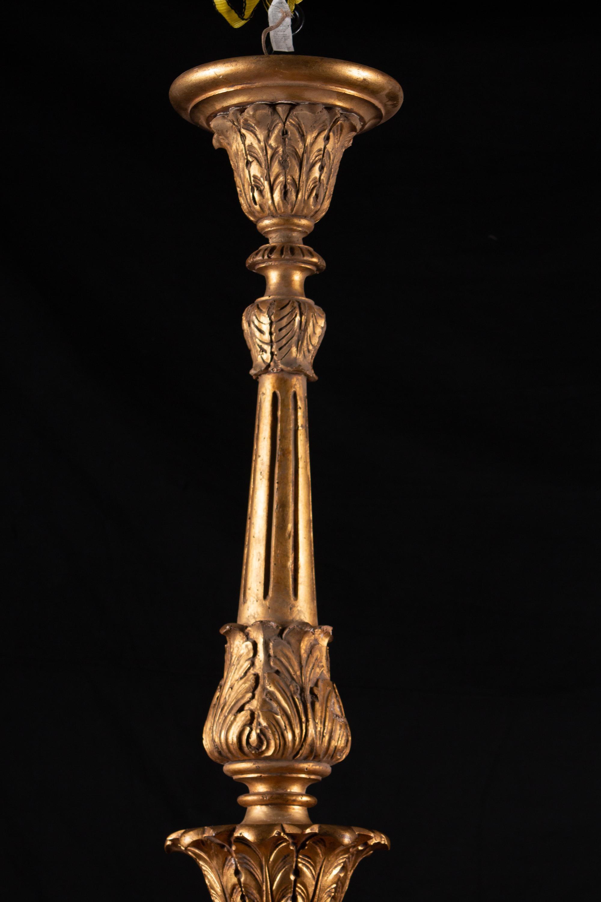 An Italian Rococo Style Giltwood Sixteen-Light Chandelier