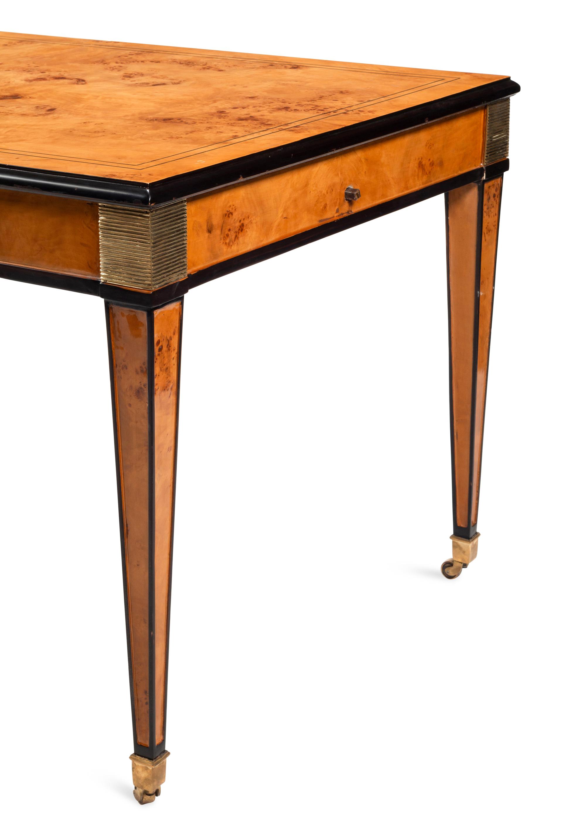A Biedermeier Style Part Ebonized Burlwood Extending Dining Table