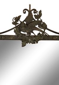 A Wrought Iron Framed Mirror