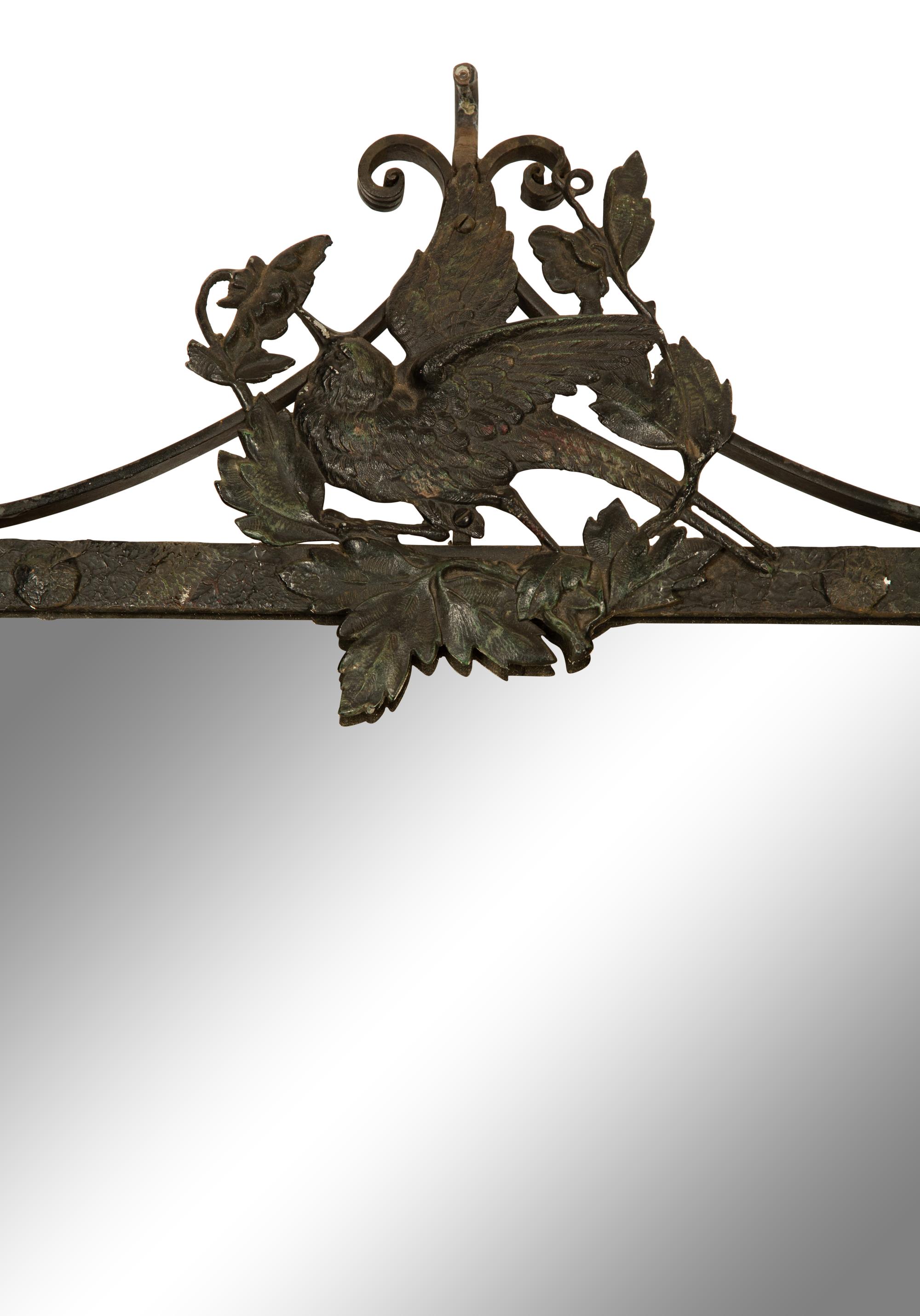 A Wrought Iron Framed Mirror