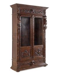 A Dutch Baroque Revival Carved Oak Cupboard