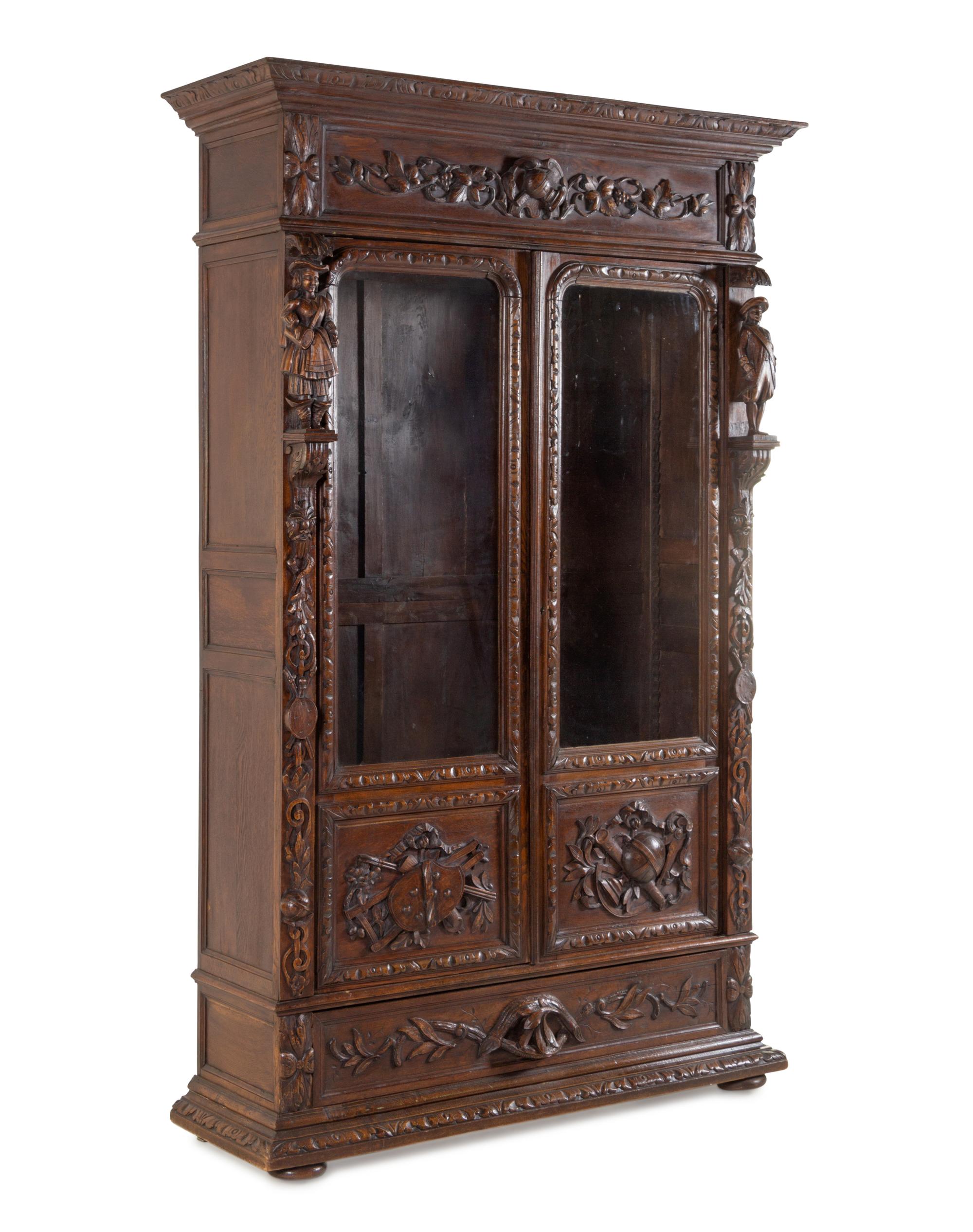 A Dutch Baroque Revival Carved Oak Cupboard