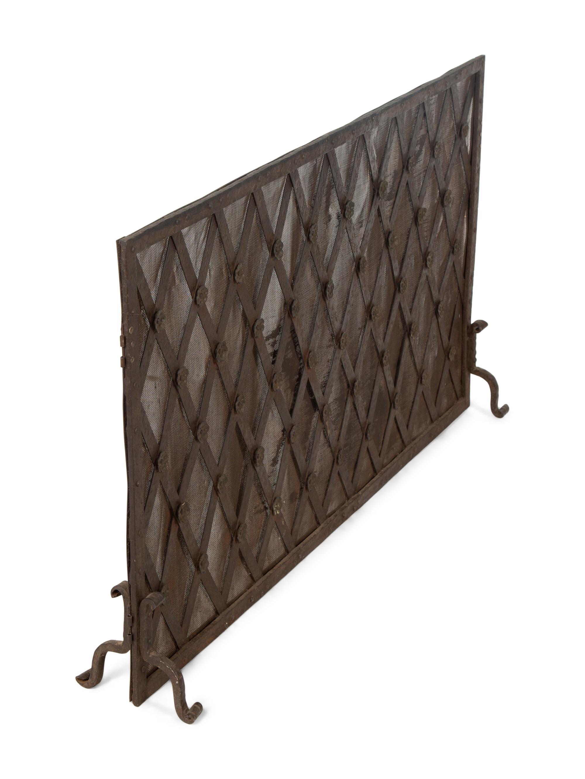A Continental Neoclassical Style Parcel Gilt Iron Fire Screen