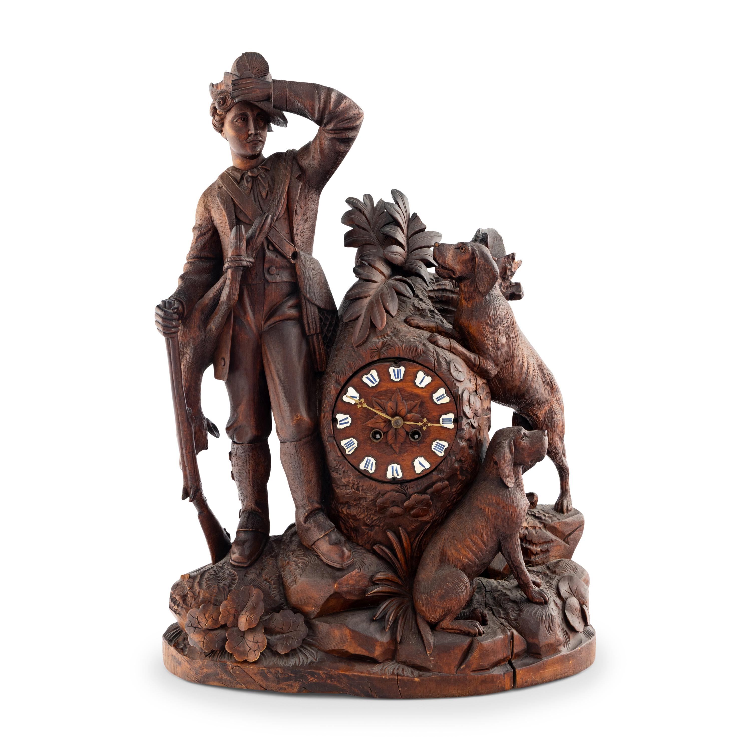 A Swiss "Black Forest" Carved Oak Figural Mantel Clock
