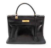 An Hermes 35cm Black Leather Kelly Bag, 13 1/2 x 9 1/2 x 5 inches.