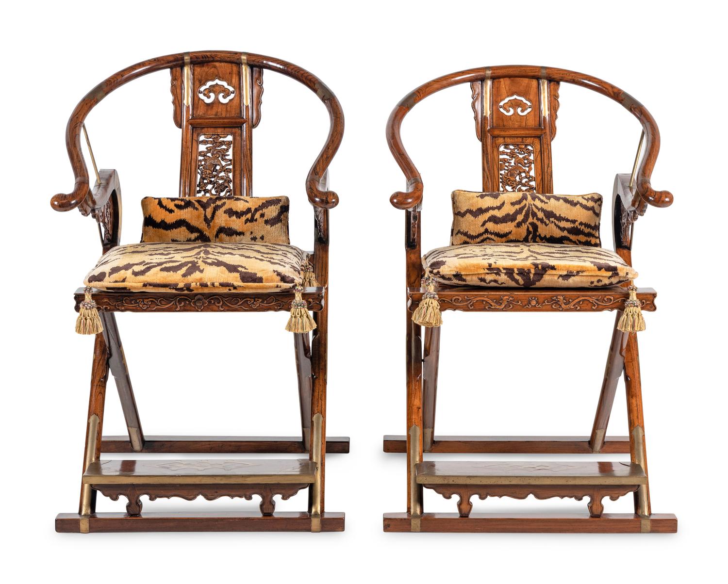 A Pair of Chinese Brass Mounted Hardwood Horseshoe-Back Campaign Chairs