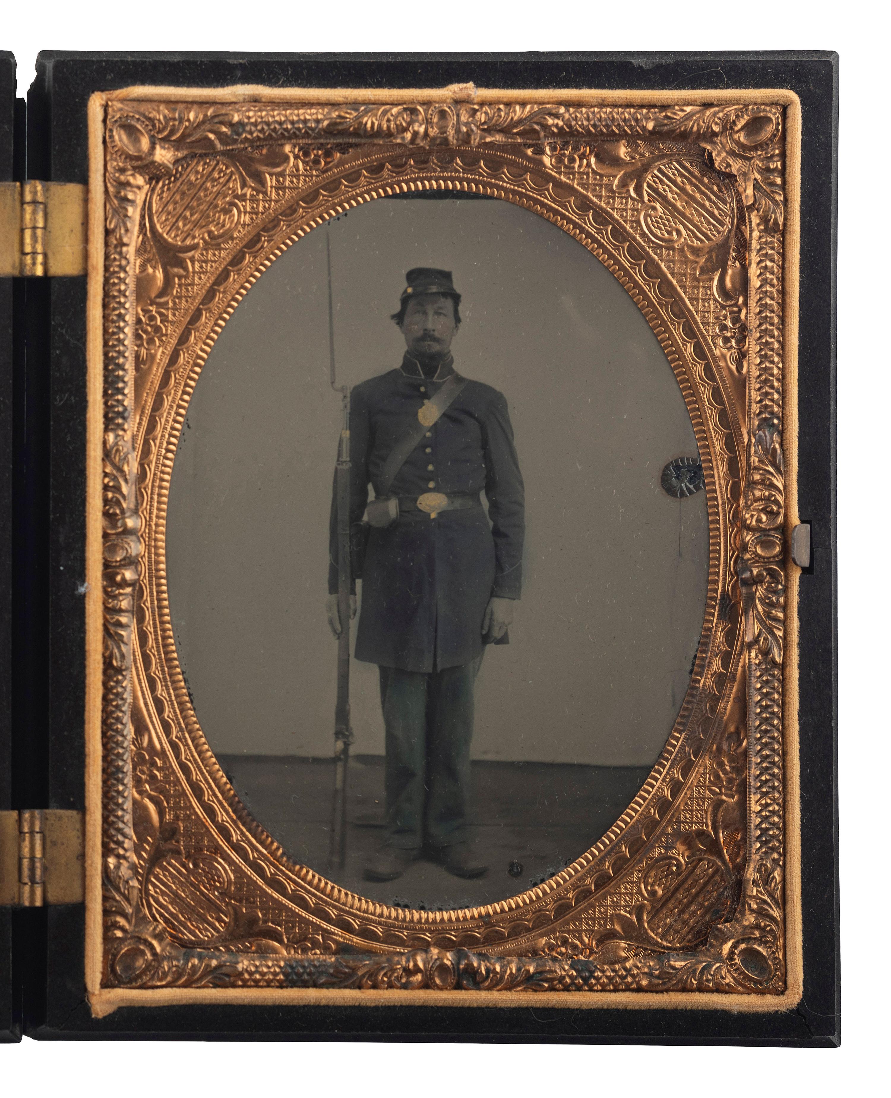 [CIVIL WAR]. Quarter plate ruby ambrotype of soldier standing with bayonet.