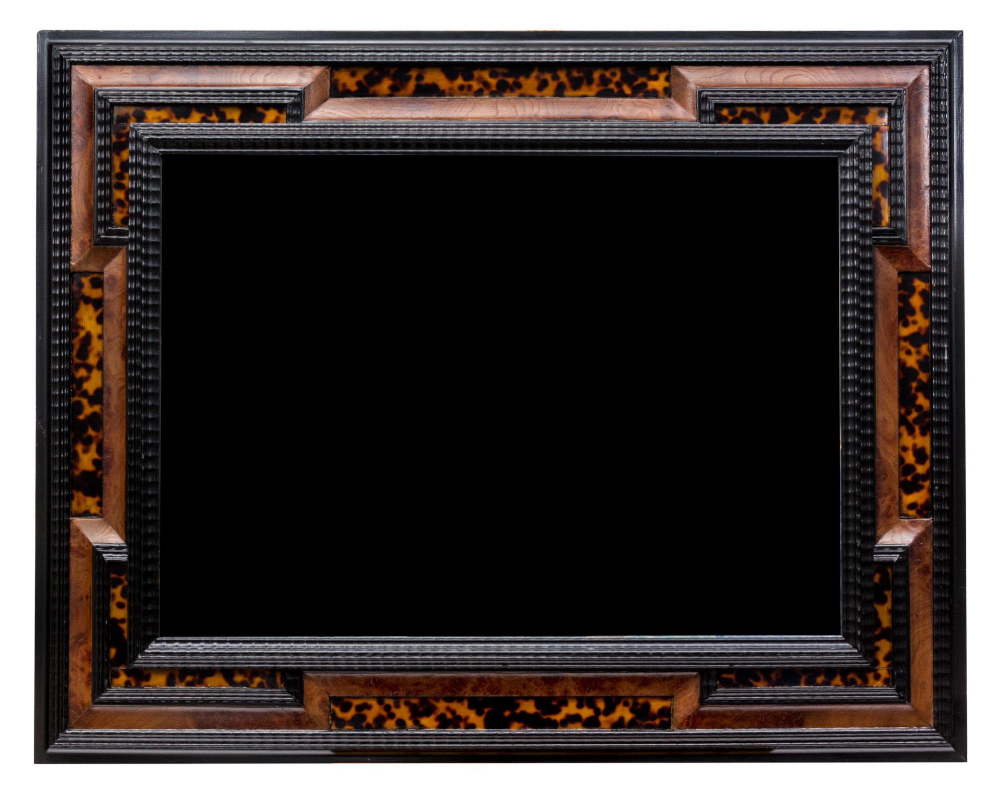 A Baroque Style Tortoiseshell Veneered Burr Walnut and Parcel Ebonized Mirror 37 x 28 inches.