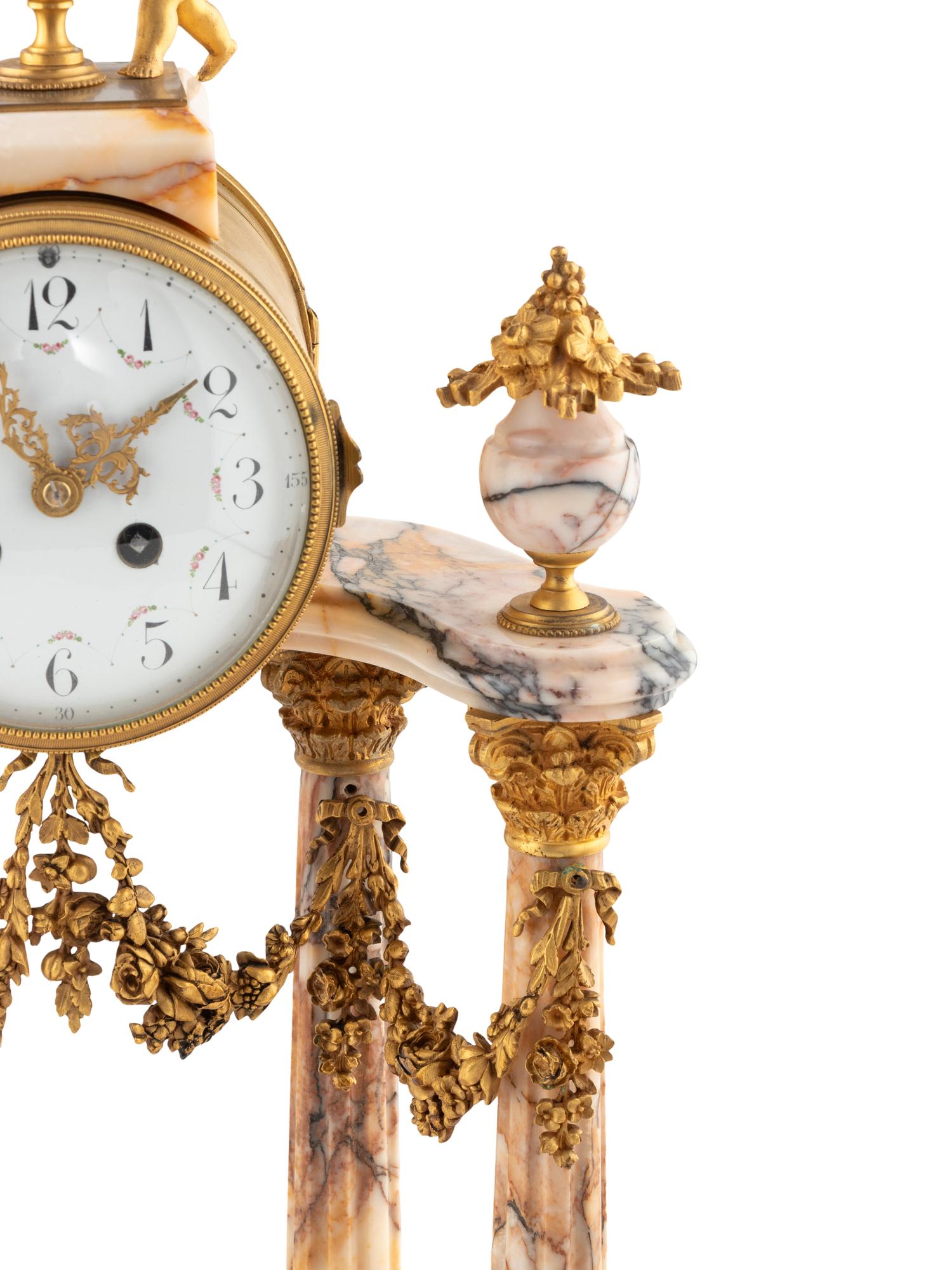 A French Gilt Bronze and Marble Mantel Clock Garniture