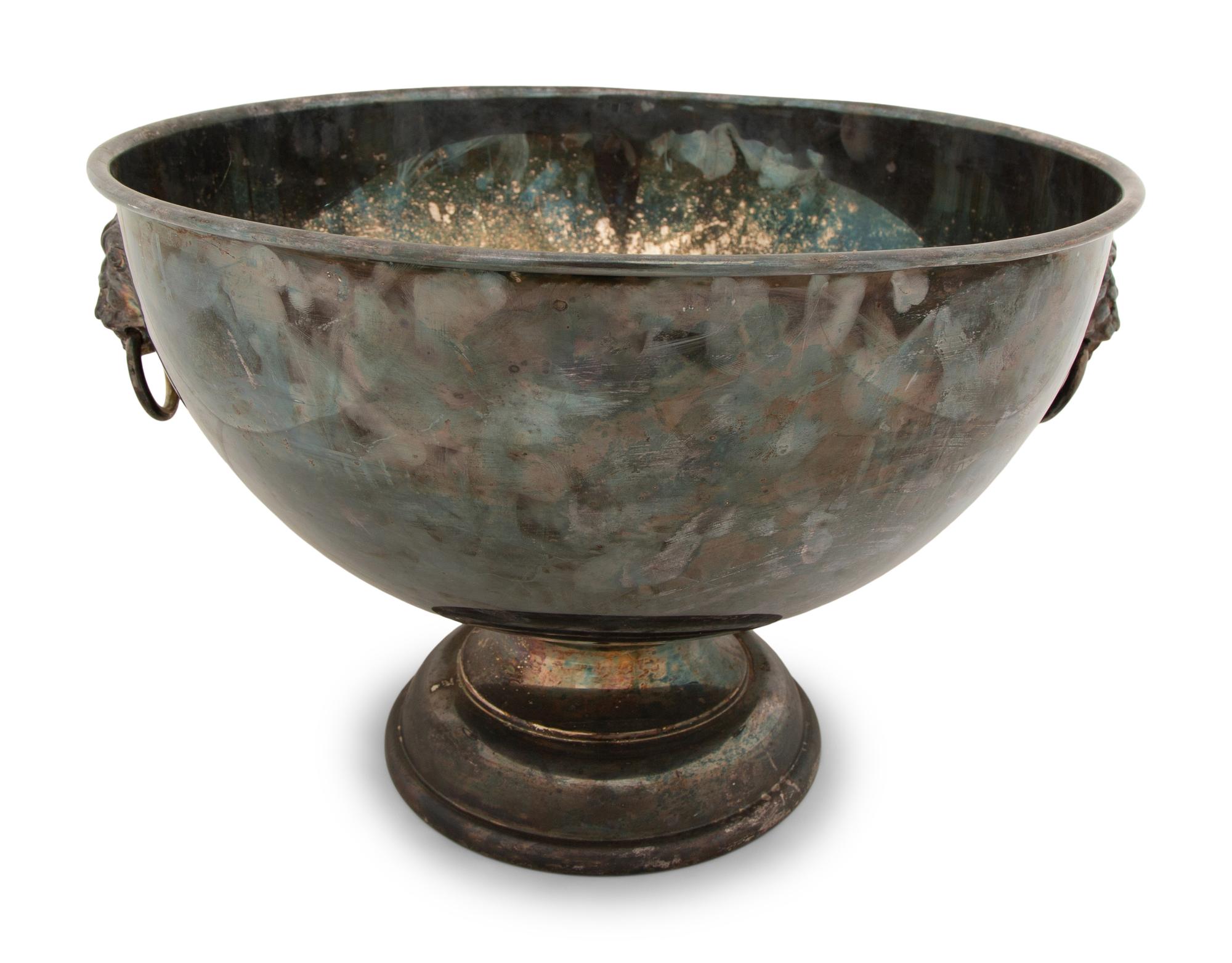 An Assembled Trio of Silverplate Footed Punch Bowls with Lionhead Handles