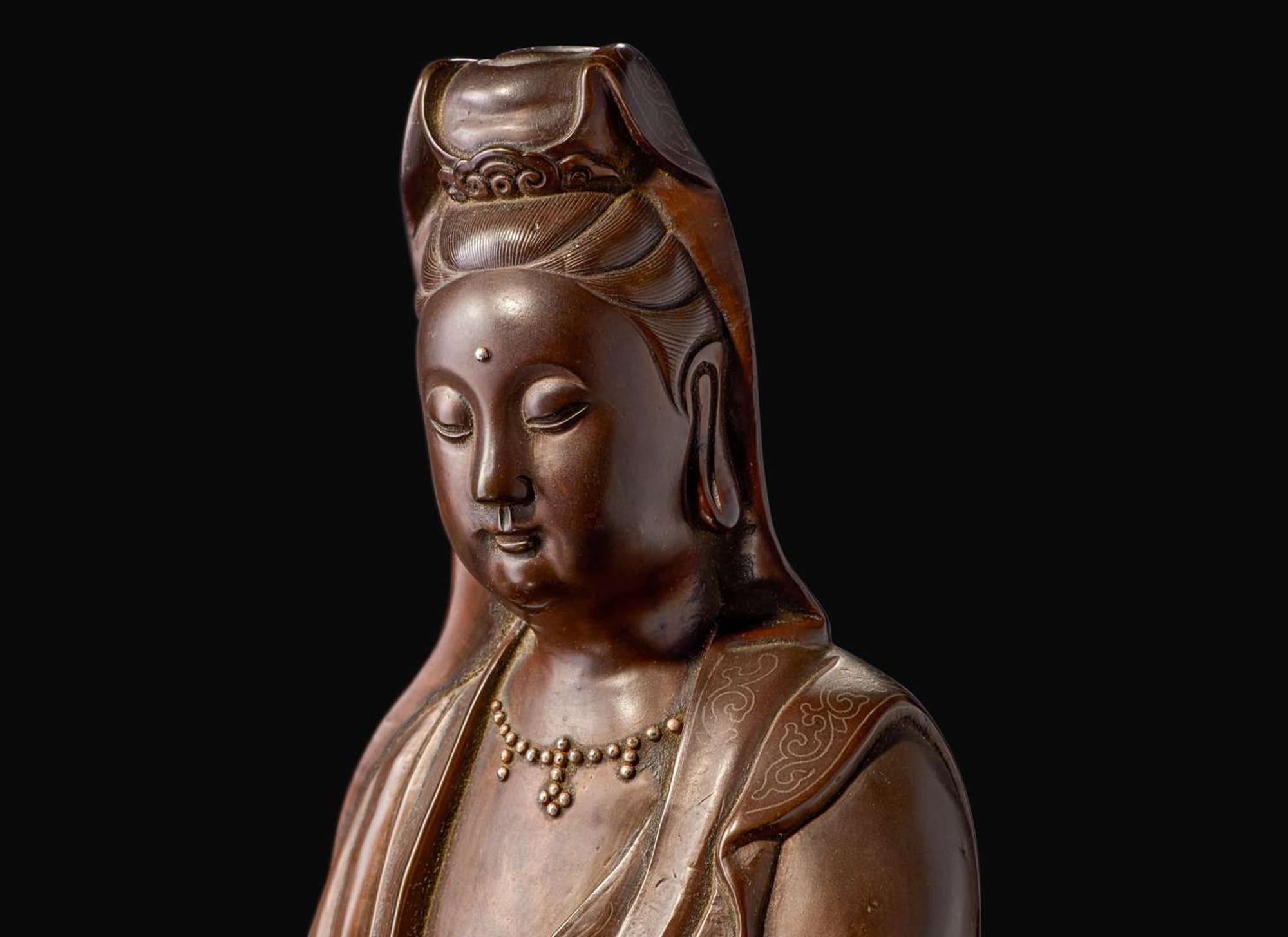 A large silver-inlaid bronze standing figure of Guanyin, signed Yu Tang Shi Sou 銅嵌銀觀音像 玉堂石叟款