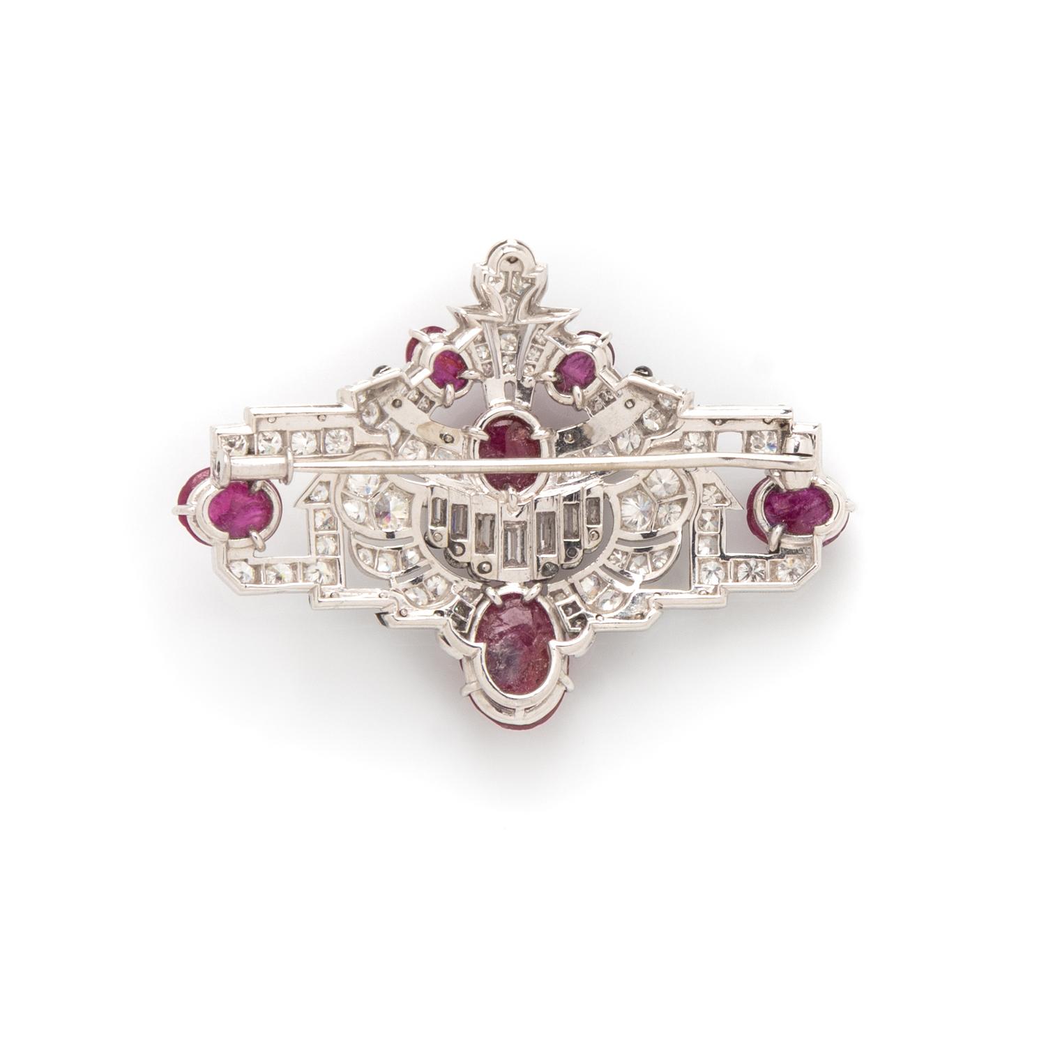 MAUBOUSSIN, ART DECO, CARVED RUBY, DIAMOND, AND BLACK ENAMEL BROOCH
