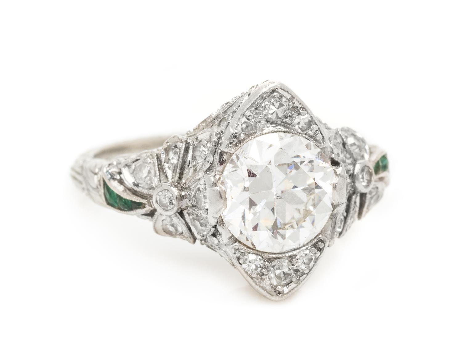 An Edwardian Platinum, Diamond and Emerald Ring, 3.35 dwts.