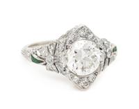 An Edwardian Platinum, Diamond and Emerald Ring, 3.35 dwts.