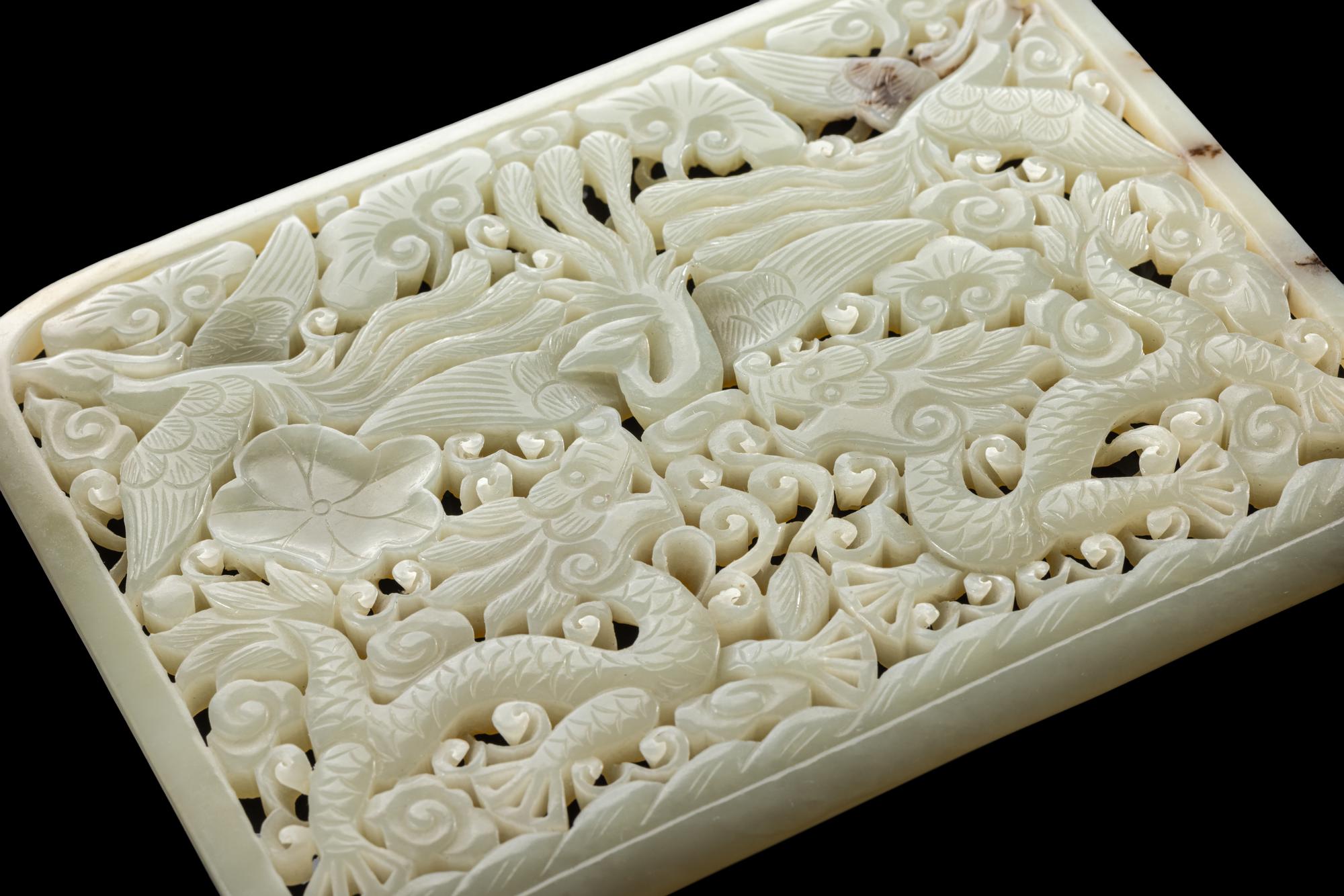 A Chinese Reticulated Jade Plaque and An Archaistic Jade Figure 青玉鏤雕龍鳳紋屏及仿古玉俑