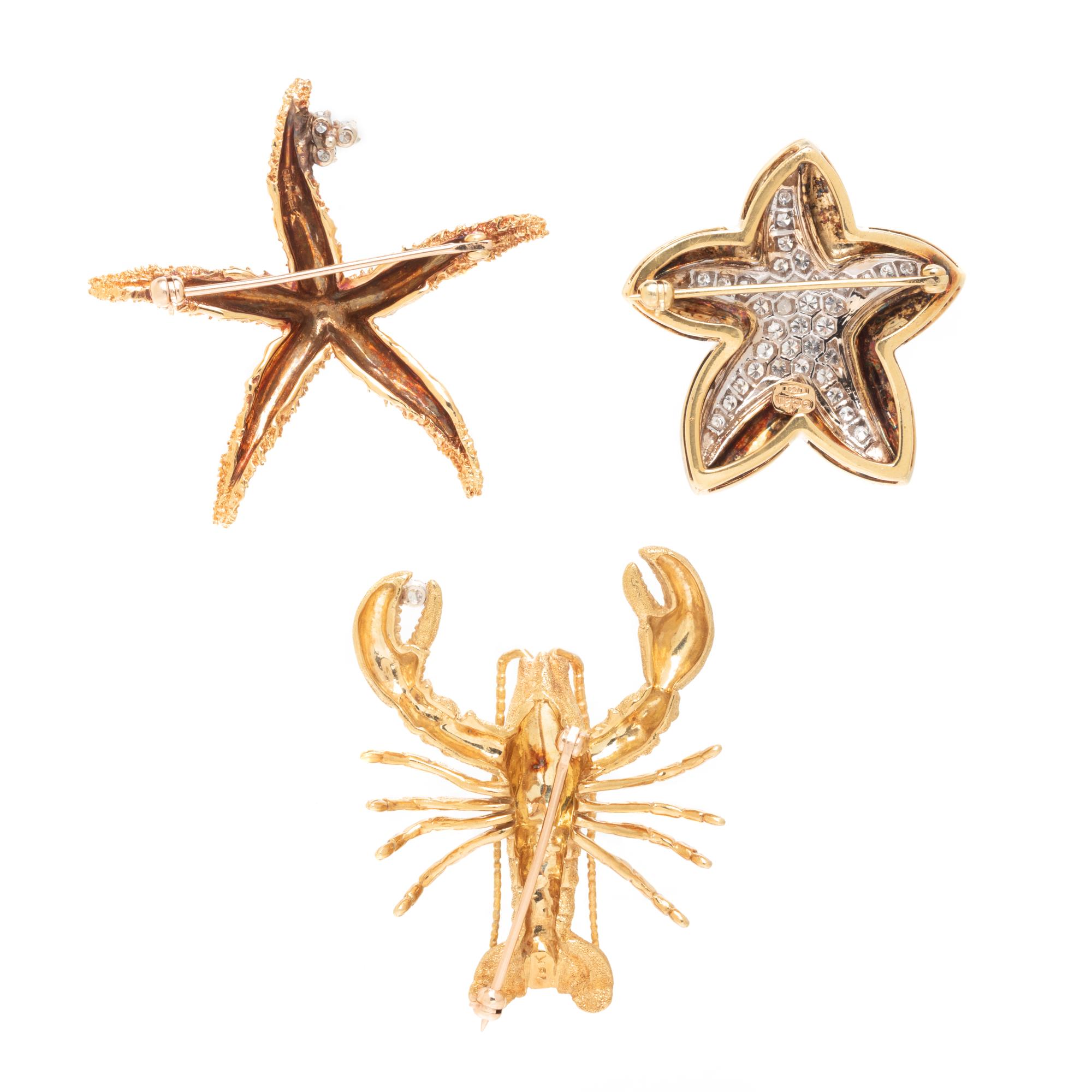 COLLECTION OF YELLOW GOLD SEASHORE BROOCHES
