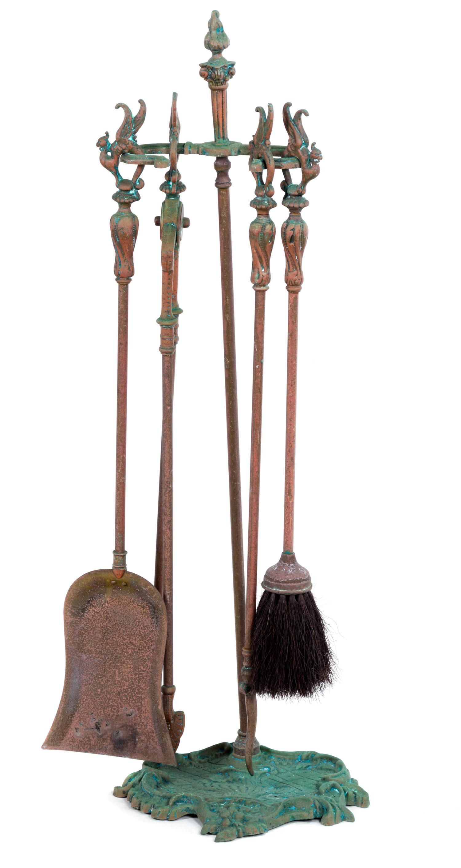 A Set of Baroque Style Brass Brass Fire Tools. Height of tool stand 24 inches.