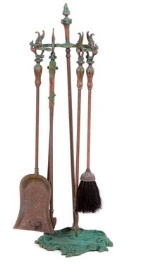 A Set of Baroque Style Brass Brass Fire Tools. Height of tool stand 24 inches.