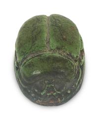 A Grueby Pottery Matte Green Scarab Paperweight