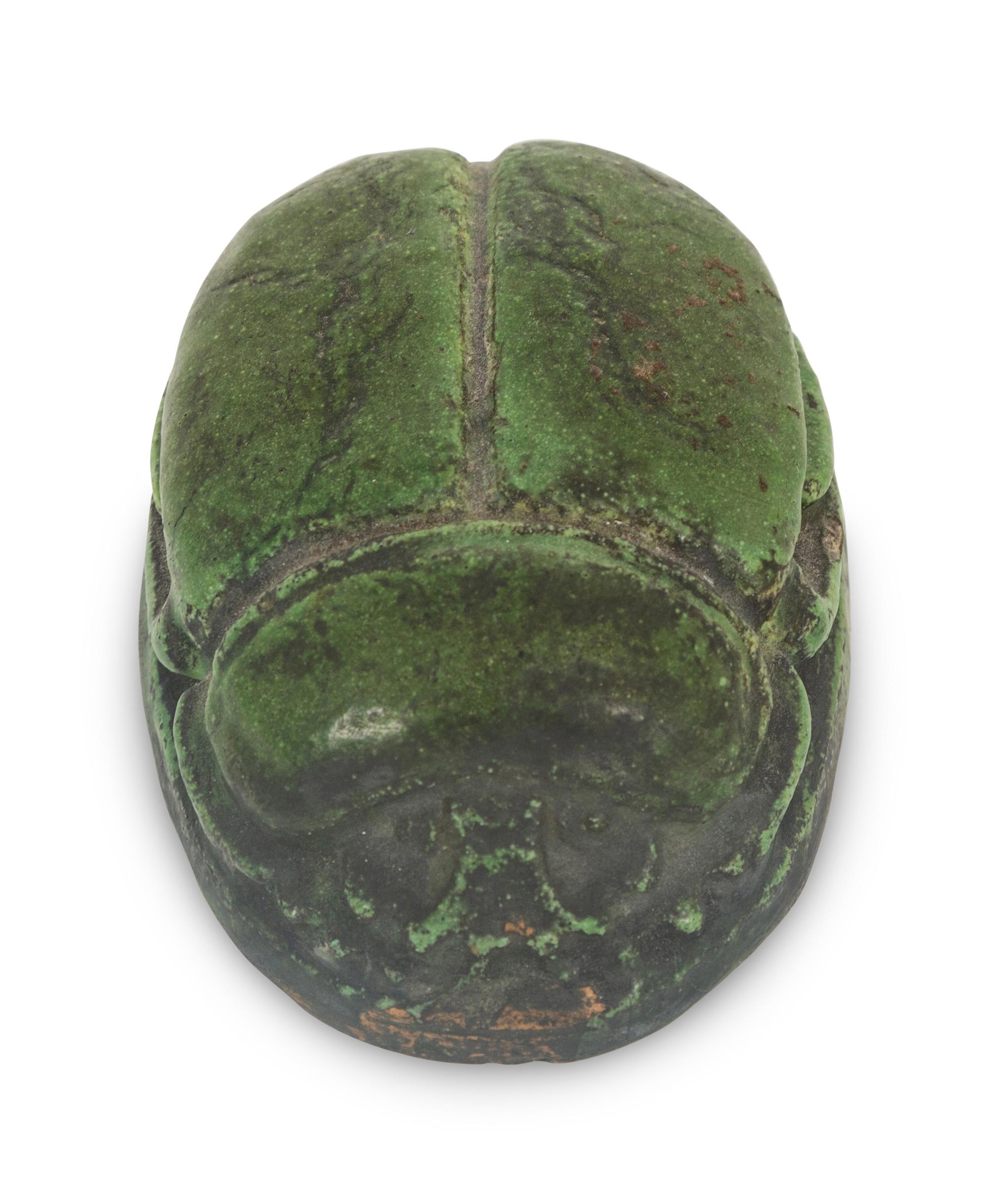 A Grueby Pottery Matte Green Scarab Paperweight