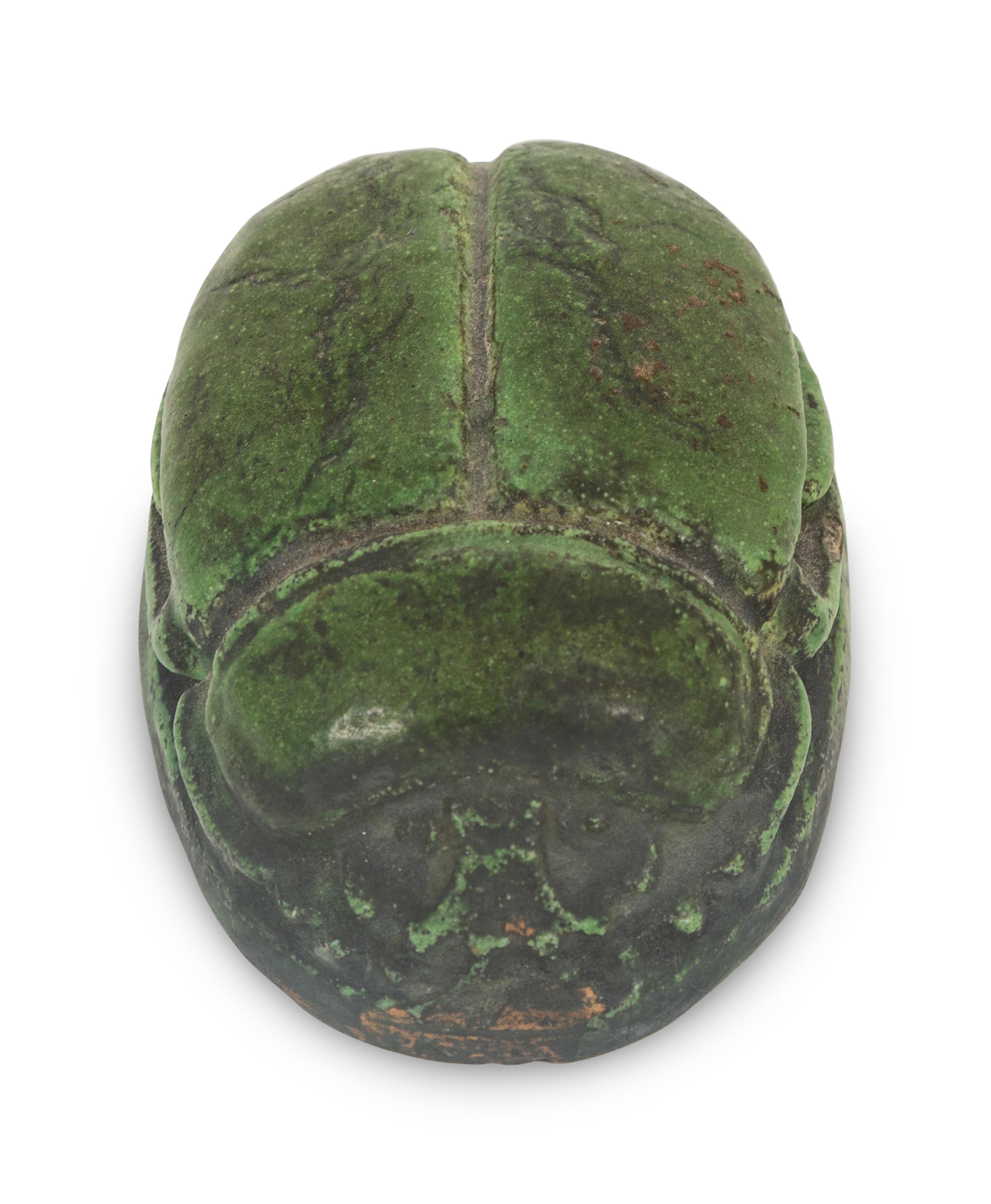 A Grueby Pottery Matte Green Scarab Paperweight