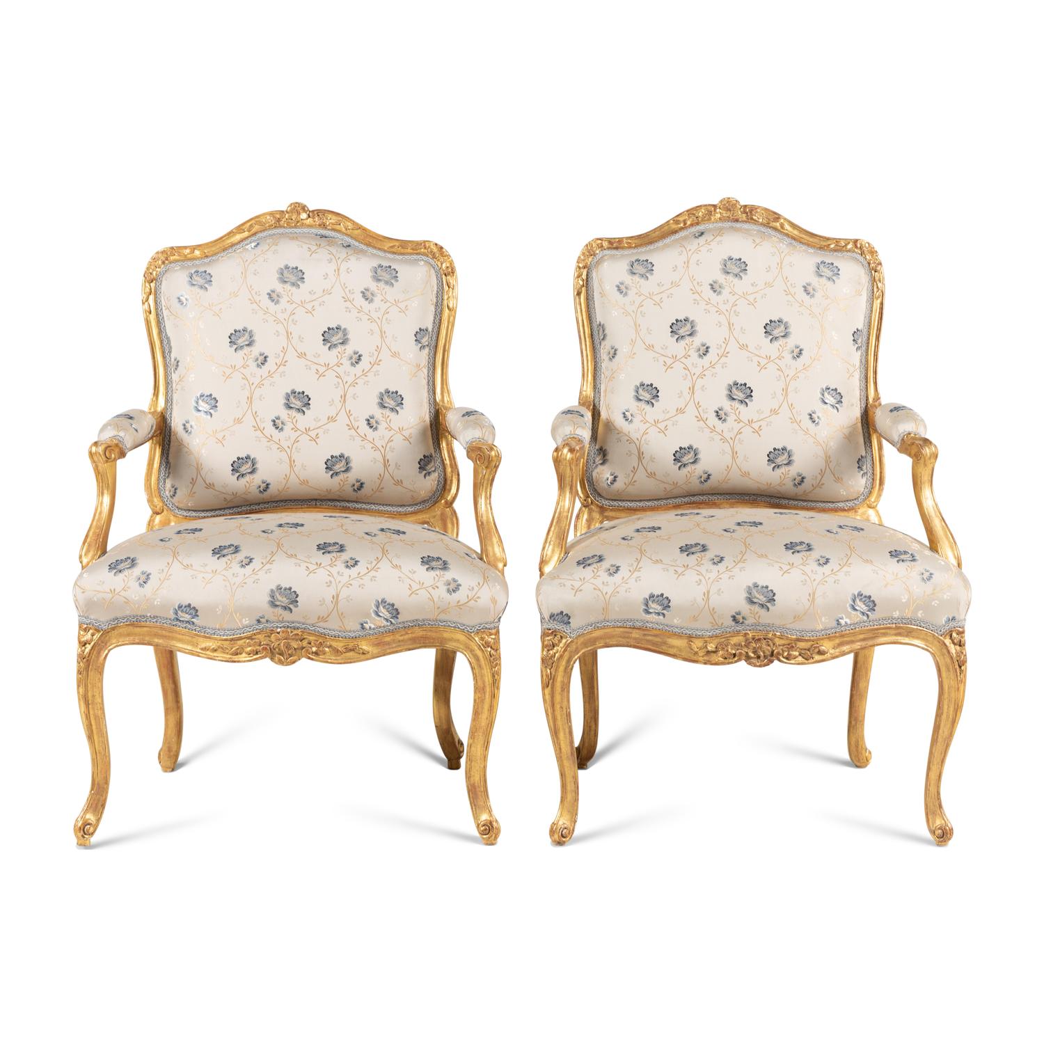 A Pair of Louis XV Carved and Giltwood Fauteuils à la Reine