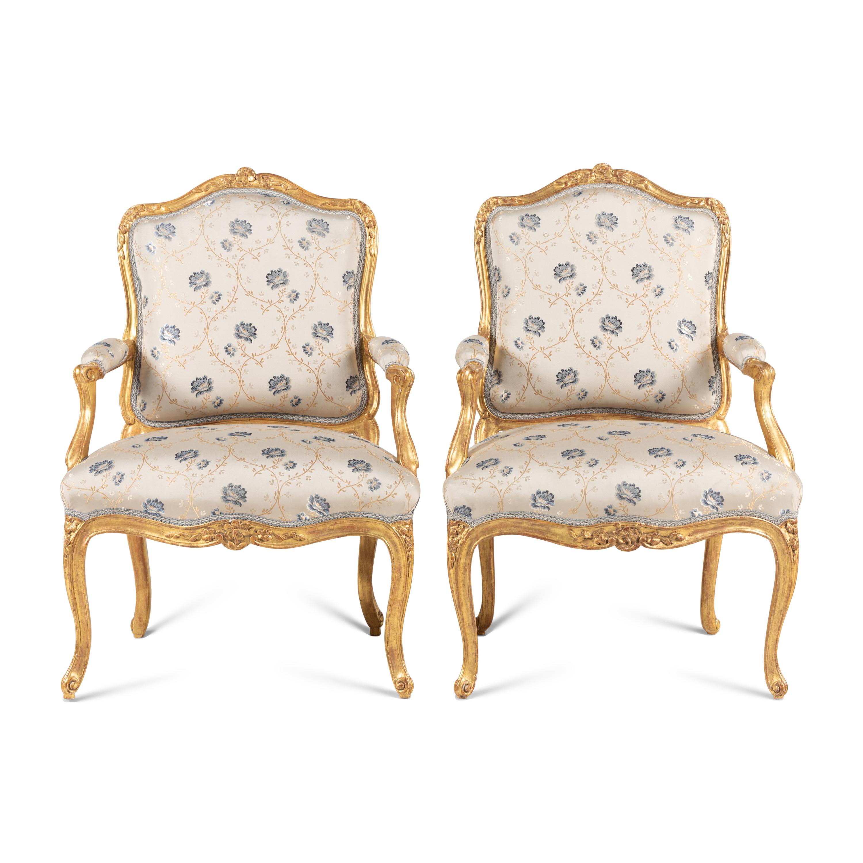 A Pair of Louis XV Carved and Giltwood Fauteuils à la Reine