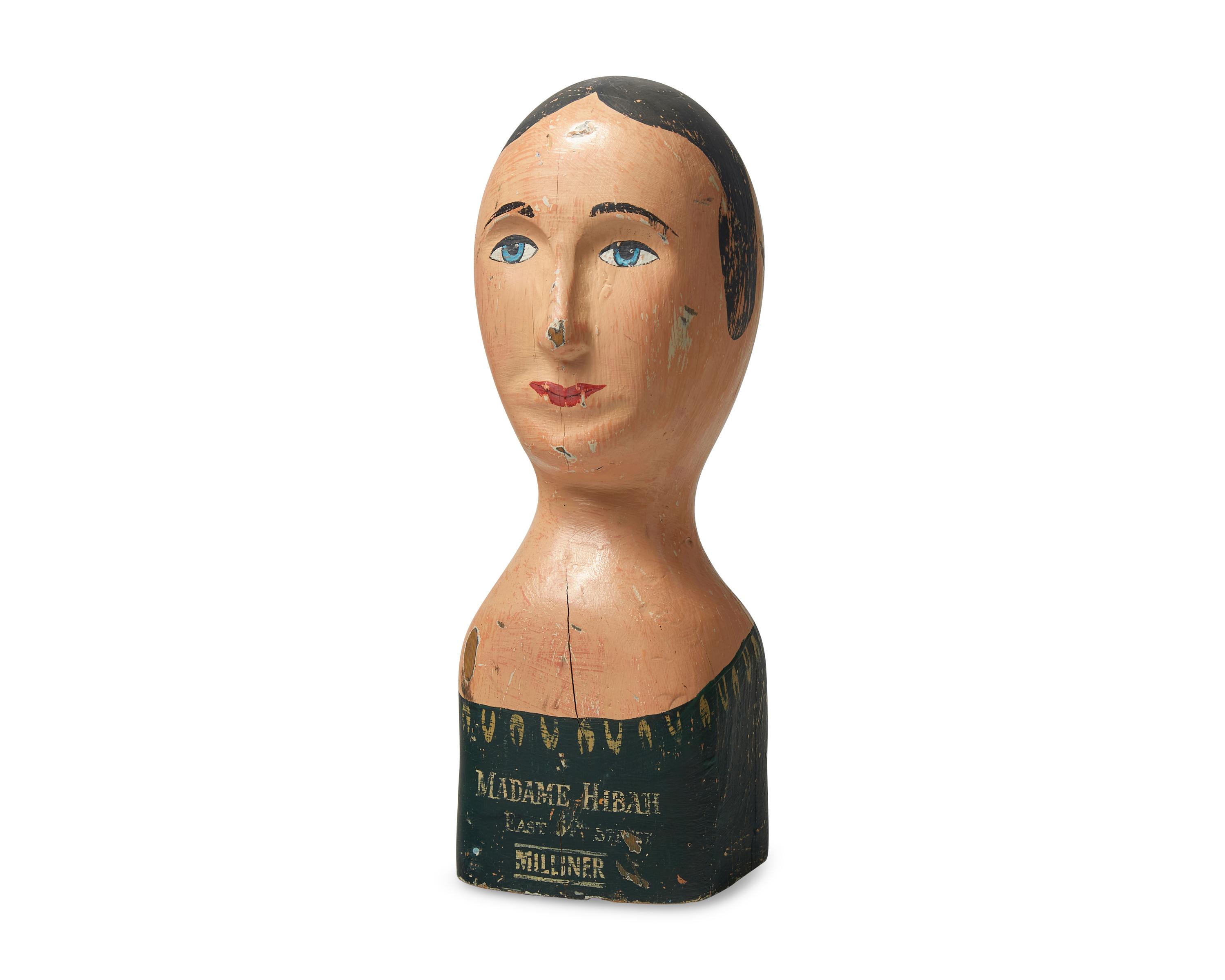 A Carved and Painted Milliner's Model Head