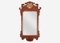 A small Chippendale fret-carved burl walnut and parcel-gilt looking glass, second half 18th century