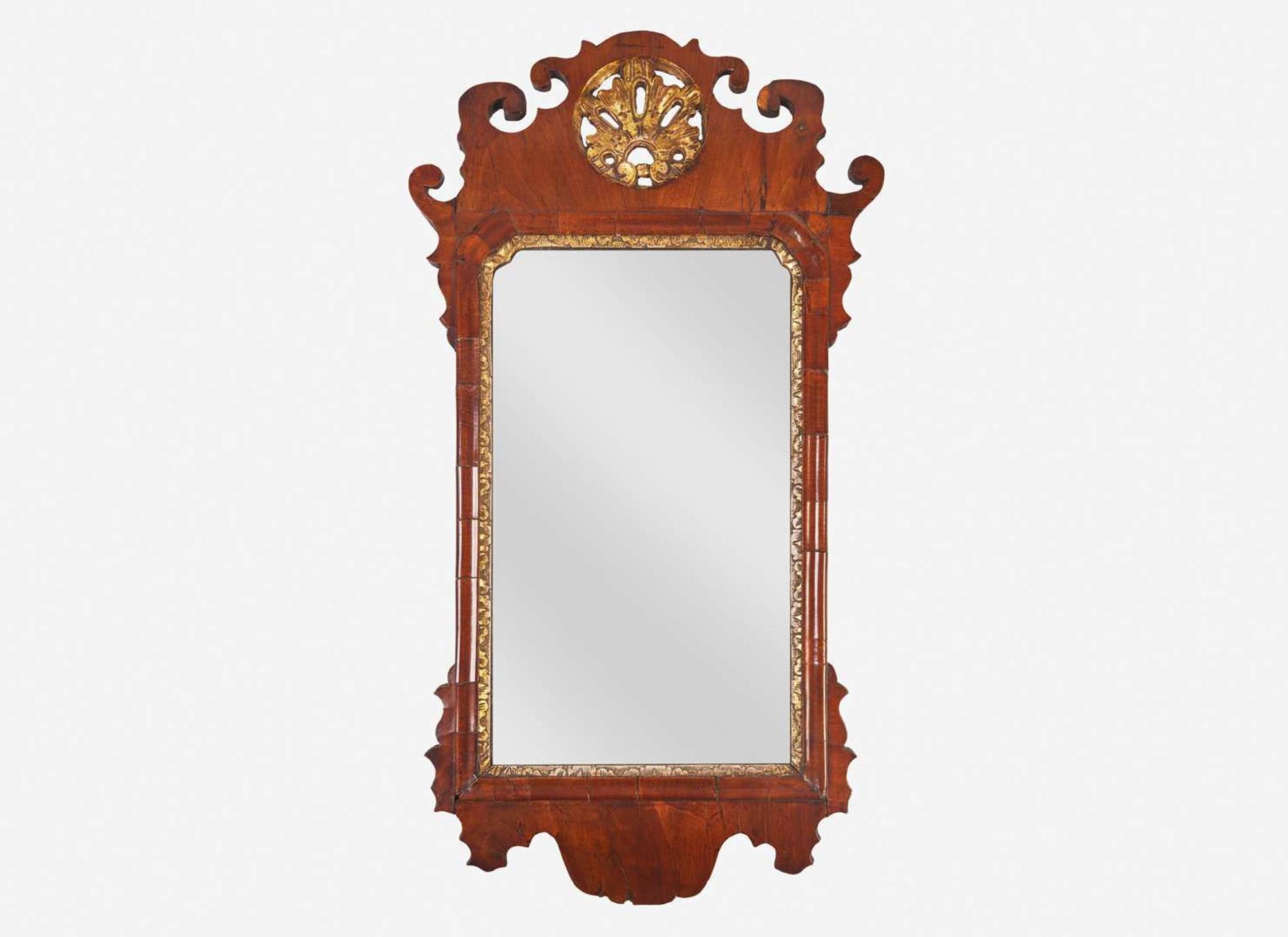 A small Chippendale fret-carved burl walnut and parcel-gilt looking glass, second half 18th century