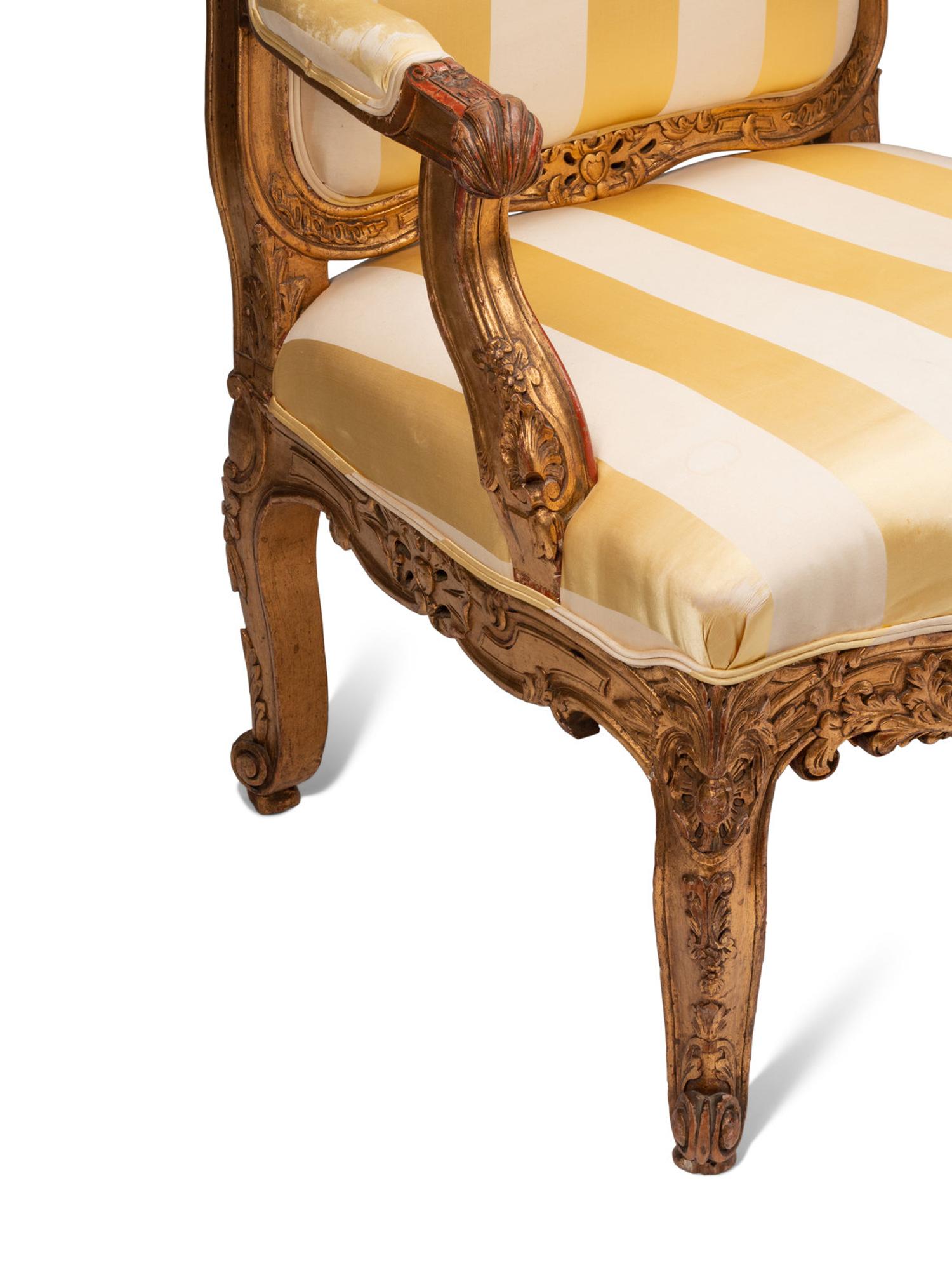 A Pair of Régence Style Giltwood Fauteuils