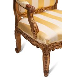 A Pair of Régence Style Giltwood Fauteuils