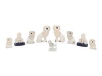 A Collection of Nine Staffordshire Glazed Poodles
