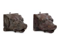 A Pair of Carved Walnut Dog-Form Wall Mounts
