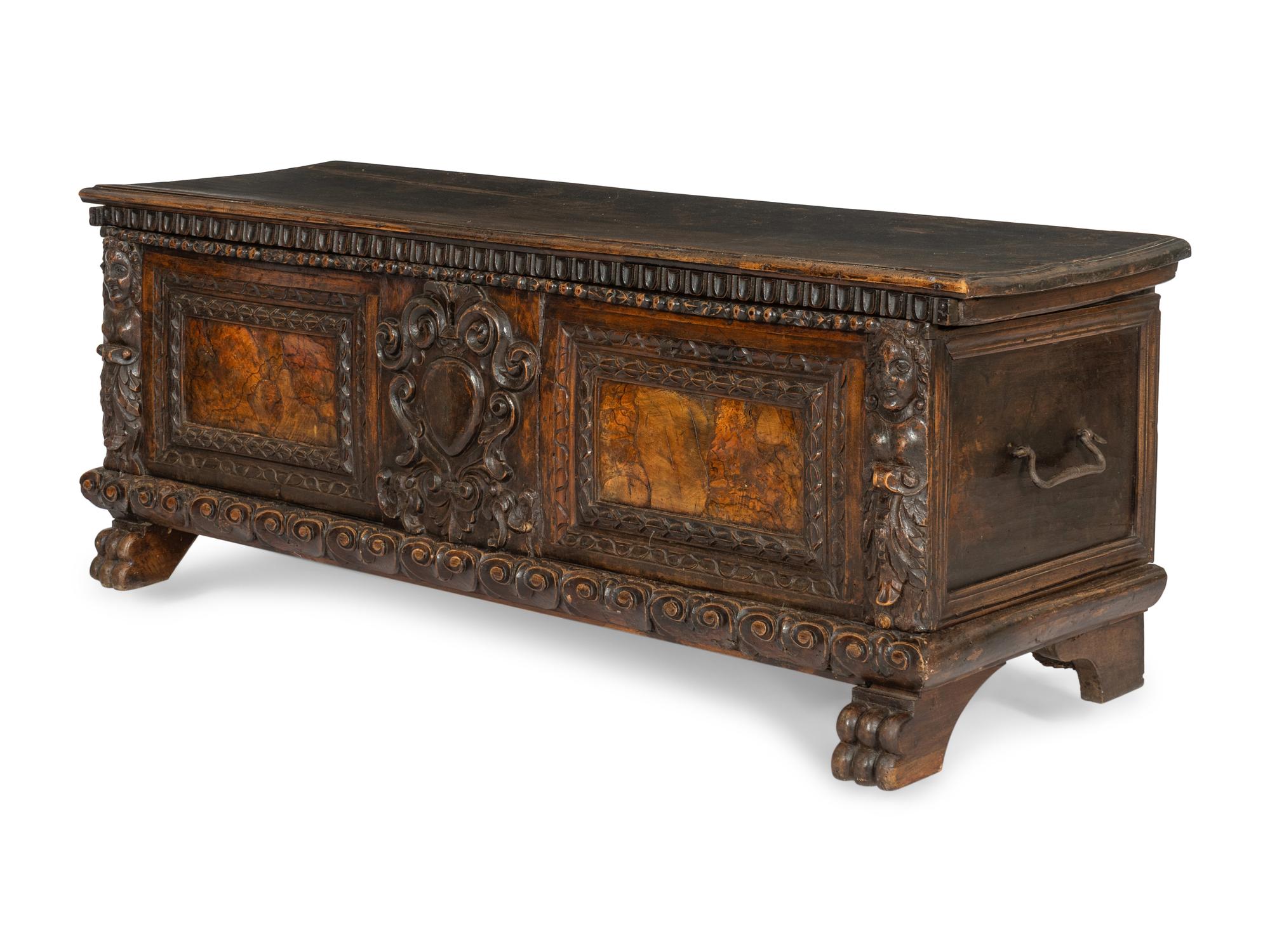 An Italian Baroque Carved Walnut Cassone