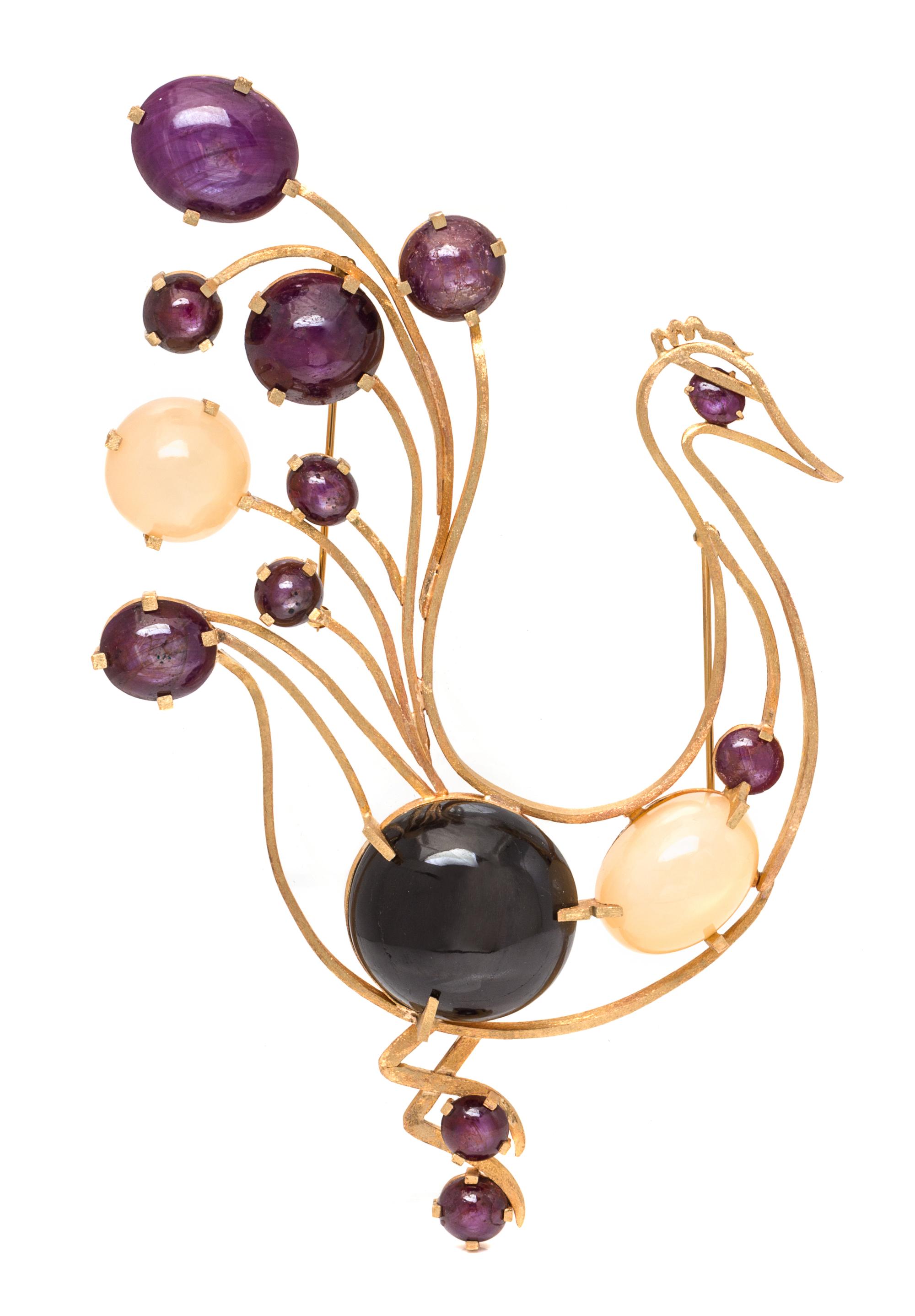 A Yellow Gold, Star Ruby, Moonstone and Black Star Sapphire Brooch, 133.80 dwts.