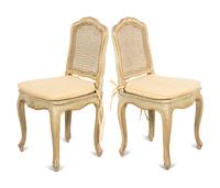 A Set of Four Louis XV Style Painted and Parcel Gilt Dining Chairs
