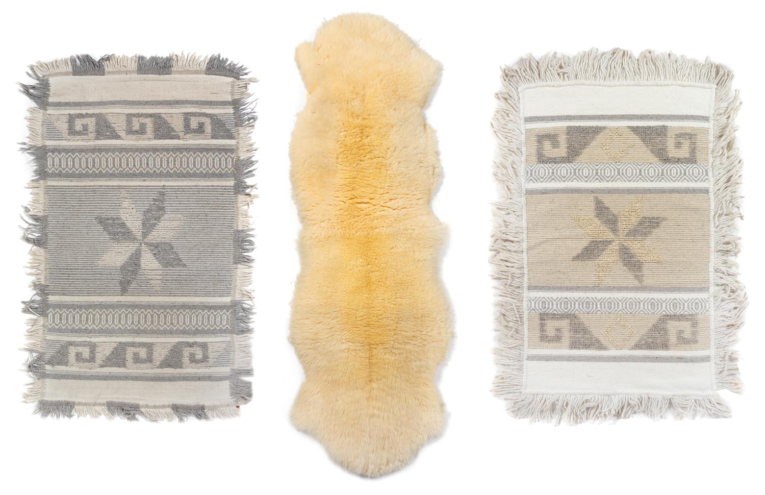 A Group of Handwoven Textiles and a Lambskin Rug