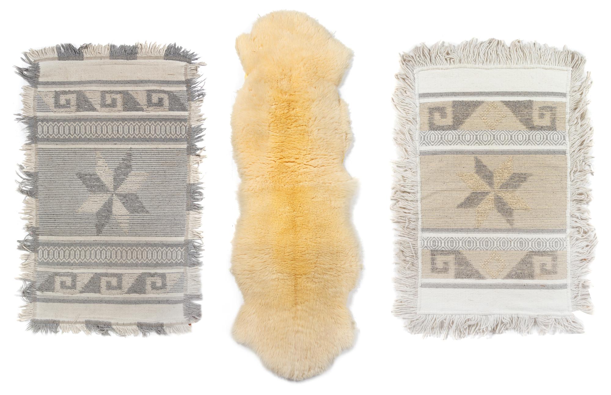 A Group of Handwoven Textiles and a Lambskin Rug