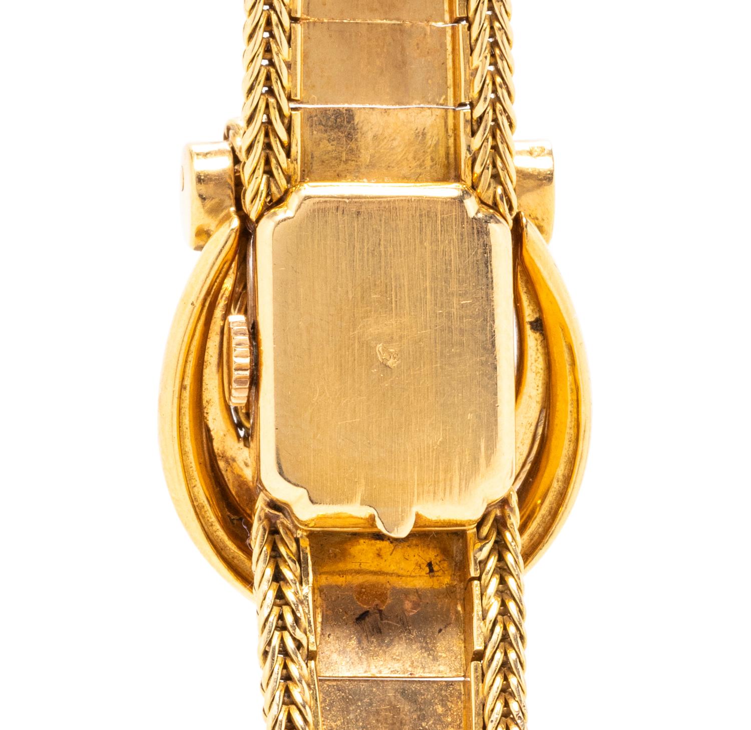 MOVADO, 18K YELLOW GOLD SURPRISE WATCH